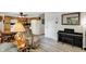 Bright and open living space with a view into the kitchen and dining area, plus a Kawai piano at 9042 Panorama Ct, Indianapolis, IN 46234