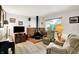 Spacious living room with a retro fireplace, hardwood floors, and comfortable seating at 9042 Panorama Ct, Indianapolis, IN 46234