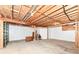 Spacious unfinished basement with exposed wood ceiling, concrete floor, and white painted walls, providing ample storage space at 10005 Southwind Dr, Indianapolis, IN 46256