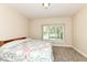 A cozy bedroom is brightened by a large window and offers a comfortable retreat at 10005 Southwind Dr, Indianapolis, IN 46256
