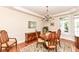 Traditional dining room featuring hardwood floors, a chandelier, and elegant furnishings at 10005 Southwind Dr, Indianapolis, IN 46256