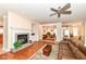 Bright living room with fireplace, built-in shelving, and views into the dining area at 10005 Southwind Dr, Indianapolis, IN 46256