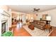 Spacious living room featuring a fireplace, hardwood floors, and an open floor plan at 10005 Southwind Dr, Indianapolis, IN 46256