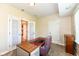 Office or den with natural light, neutral color palette, and easy access to another room at 10005 Southwind Dr, Indianapolis, IN 46256