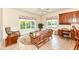 Bright sunroom with tile flooring, large windows, and comfortable seating area at 10005 Southwind Dr, Indianapolis, IN 46256