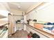 Spacious walk-in closet with multiple shelves and hanging rods for organized storage at 10005 Southwind Dr, Indianapolis, IN 46256