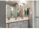 Bathroom with a white vanity, large mirror, updated fixtures, and neutral walls at 10480 Stonegate Dr, Fishers, IN 46040