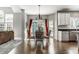 Eat-in kitchen with dining area featuring a modern chandelier and large windows at 10480 Stonegate Dr, Fishers, IN 46040