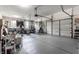 Spacious garage with ample storage, window, and a garage door at 10480 Stonegate Dr, Fishers, IN 46040