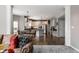 Bright open floor plan showcasing kitchen with stainless steel appliances and a view from the Gathering room at 10480 Stonegate Dr, Fishers, IN 46040