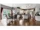 Eat-in kitchen features stainless appliances, white cabinets, and large windows overlooking the backyard at 10480 Stonegate Dr, Fishers, IN 46040