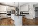 Open-concept kitchen with island, stainless appliances and ample cabinet space at 10480 Stonegate Dr, Fishers, IN 46040