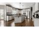 Kitchen with white cabinets, stainless steel appliances, granite countertops, and a kitchen island at 10480 Stonegate Dr, Fishers, IN 46040