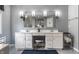 Bright main bathroom with double sinks, white vanity, and decorative mirrors at 10480 Stonegate Dr, Fishers, IN 46040