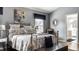 Main bedroom featuring neutral tones, a chandelier, and ensuite bath at 10480 Stonegate Dr, Fishers, IN 46040