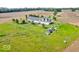 Aerial view of a house with a yard, pasture, and accessory structures at 10705 N State Road 267, Brownsburg, IN 46112