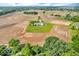 Stately home from an aerial view, bordered by trees and fields, reflecting a tranquil rural setting at 10705 N State Road 267, Brownsburg, IN 46112