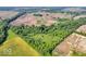 Aerial view of a property with green fields, woods, and ponds adding to the property's natural allure at 10705 N State Road 267, Brownsburg, IN 46112
