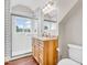 Modern bathroom featuring a tiled shower, wooden vanity, and neutral decor at 10705 N State Road 267, Brownsburg, IN 46112