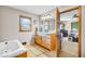 Bathroom with a vanity and soaking tub at 10705 N State Road 267, Brownsburg, IN 46112