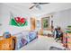 Bright bedroom featuring a single bed, natural light, and simple decor at 10705 N State Road 267, Brownsburg, IN 46112