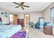 Bright bedroom showcasing a ceiling fan and carpeted flooring at 10705 N State Road 267, Brownsburg, IN 46112