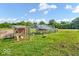 Spacious chicken coop in a large grassy yard on a partially cloudy day at 10705 N State Road 267, Brownsburg, IN 46112