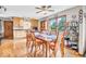 Dining area featuring wood floors, natural light, and seating for Gathering and guests at 10705 N State Road 267, Brownsburg, IN 46112