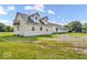 Spacious home with multiple sections, including a front porch and upper-level balcony at 10705 N State Road 267, Brownsburg, IN 46112
