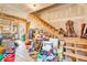 Spacious garage interior featuring exposed stairs, ample storage, and potential for customization at 10705 N State Road 267, Brownsburg, IN 46112