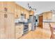 Kitchen features bright wooden cabinets and stainless steel appliances offering a clean design at 10705 N State Road 267, Brownsburg, IN 46112