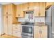 Spacious kitchen offering abundant wood cabinets and stainless steel appliances at 10705 N State Road 267, Brownsburg, IN 46112