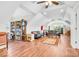 Open concept living space with hardwood floors, a large window, and vaulted ceilings at 10705 N State Road 267, Brownsburg, IN 46112