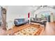 Bright living room with hardwood floors and comfortable seating arrangements at 10705 N State Road 267, Brownsburg, IN 46112