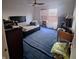 Cozy bedroom with natural light and blue carpeted floors at 10775 Cyrus Dr, Indianapolis, IN 46231