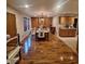 Spacious dining room showcasing hardwood floors, an elegant chandelier, and abundant natural light at 10775 Cyrus Dr, Indianapolis, IN 46231