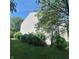Side view of the home with well-maintained landscaping at 10775 Cyrus Dr, Indianapolis, IN 46231