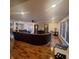 A spacious living room boasts hardwood floors, recessed lighting, and an expansive sectional sofa at 10775 Cyrus Dr, Indianapolis, IN 46231