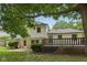 Spacious backyard features a large wooden deck and attractive stone and siding exterior at 10778 Haverstick Rd, Carmel, IN 46033