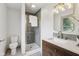 Stylish bathroom featuring modern fixtures, a glass enclosed shower, and a wooden vanity for a spa-like experience at 10778 Haverstick Rd, Carmel, IN 46033