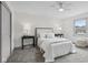Bright bedroom featuring neutral tones, a ceiling fan and plush carpet, creating a cozy and inviting atmosphere at 10778 Haverstick Rd, Carmel, IN 46033