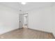 Clean, bright bedroom with wood-look floors and neutral walls at 10778 Haverstick Rd, Carmel, IN 46033