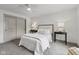 Bedroom with a plush queen bed, carpeting, and white walls at 10778 Haverstick Rd, Carmel, IN 46033