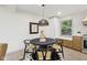 Stylish dining area with a black round table, elegant chairs, and modern decor creating an inviting atmosphere at 10778 Haverstick Rd, Carmel, IN 46033