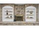 Stone fireplace with decorative accents and built-in shelving at 10778 Haverstick Rd, Carmel, IN 46033