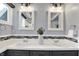 Bright bathroom with double sinks, sleek fixtures, and modern design at 1099 Saratoga Cir, Carmel, IN 46280