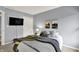 Cozy bedroom with side table and television at 1099 Saratoga Cir, Carmel, IN 46280
