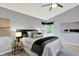 Neutral bedroom featuring a ceiling fan, neutral paint, and a window overlooking the yard at 1099 Saratoga Cir, Carmel, IN 46280