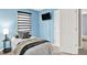 Inviting bedroom featuring a window with blinds, providing a tranquil and serene ambiance at 1099 Saratoga Cir, Carmel, IN 46280