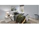 Bedroom with a window, side table, and cozy bed at 1099 Saratoga Cir, Carmel, IN 46280